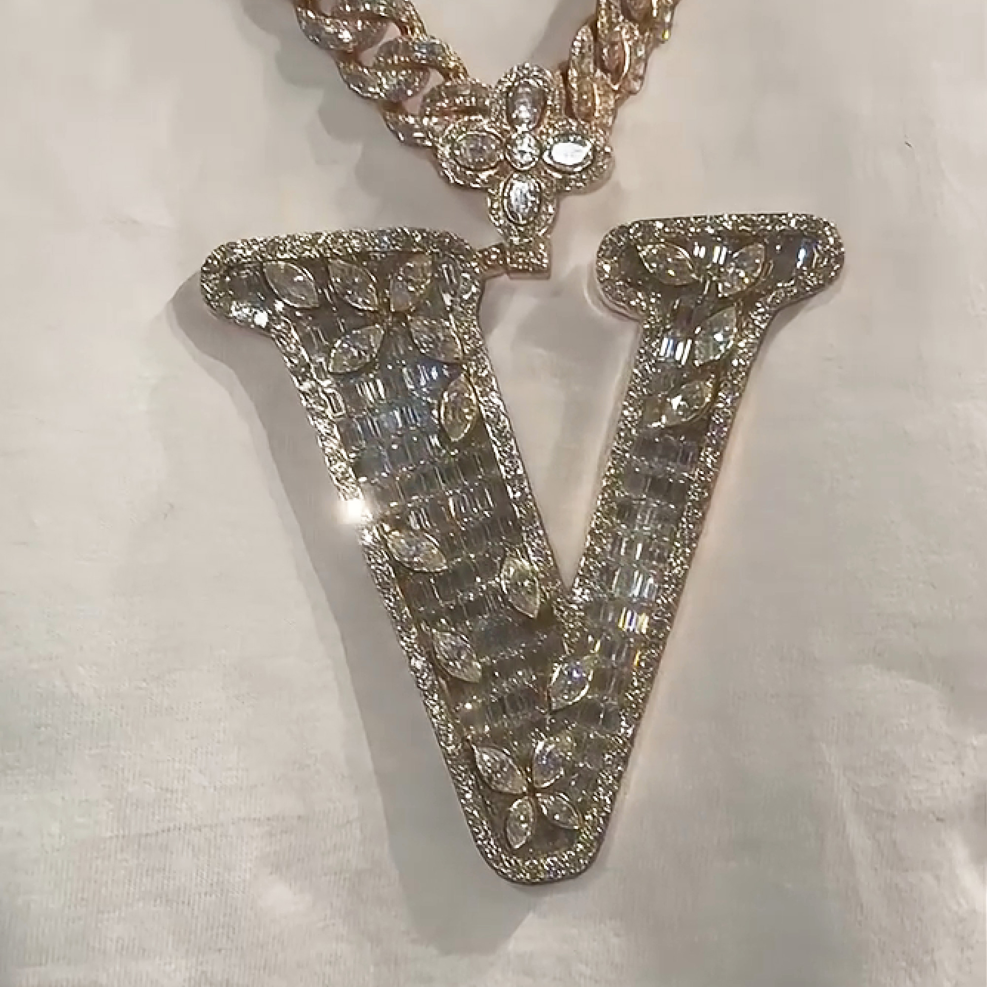 V marquise iced out initial pendant necklace featuring bold hip hop letter design with diamond shine streetwear jewelry style