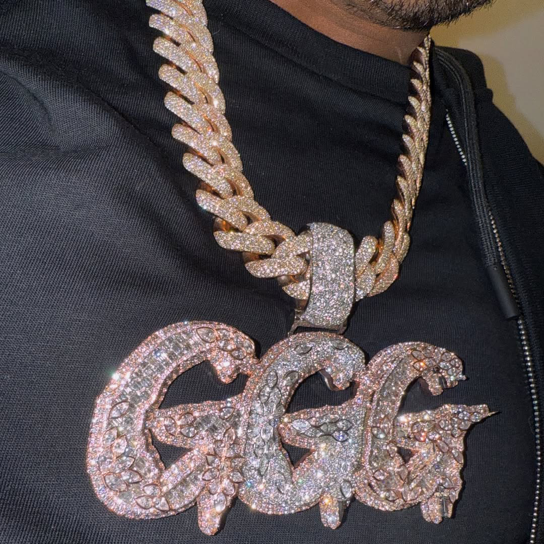 GGG letter pendant close up stone detailing luxury streetwear jewelry