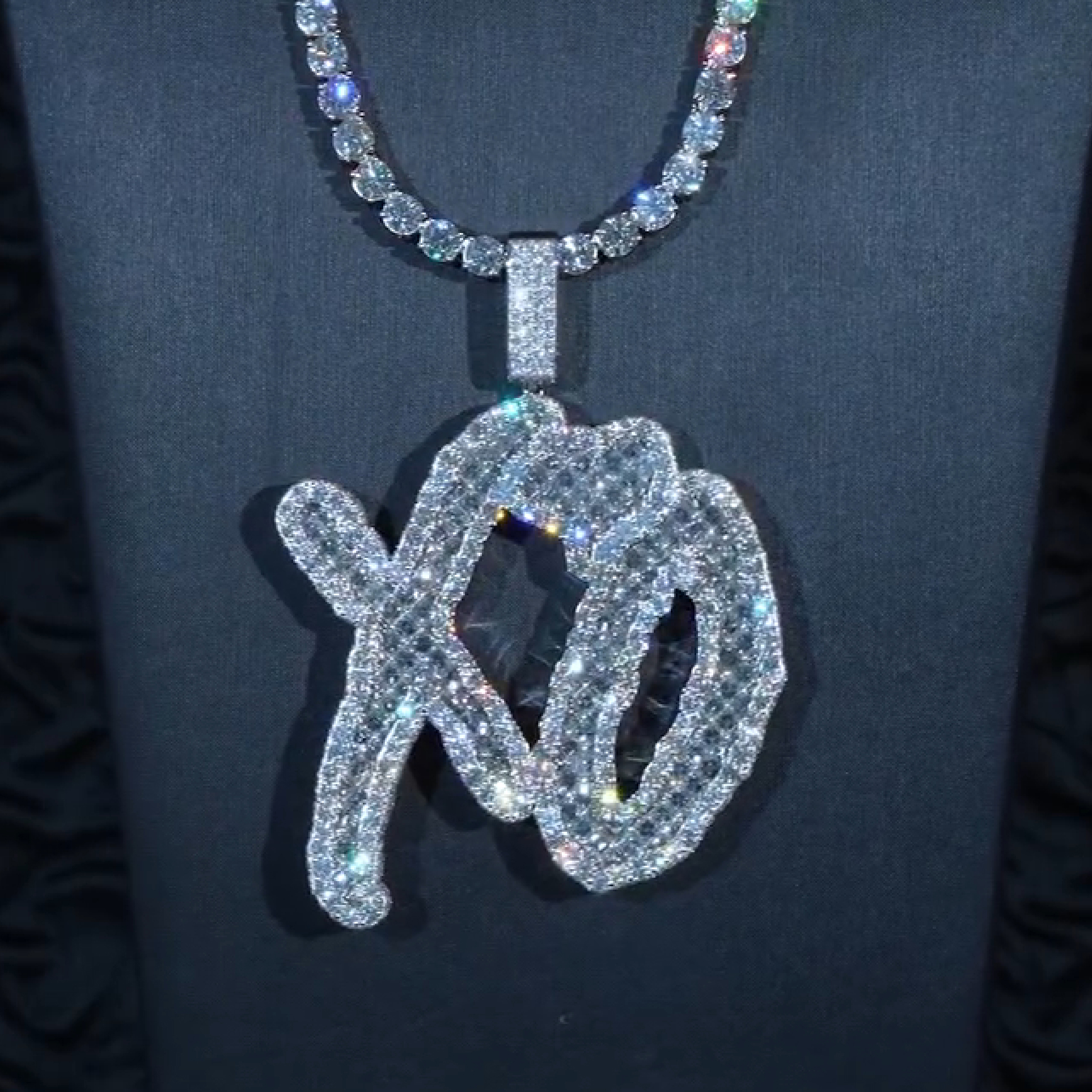 model wearing XO baguette pendant layered chains