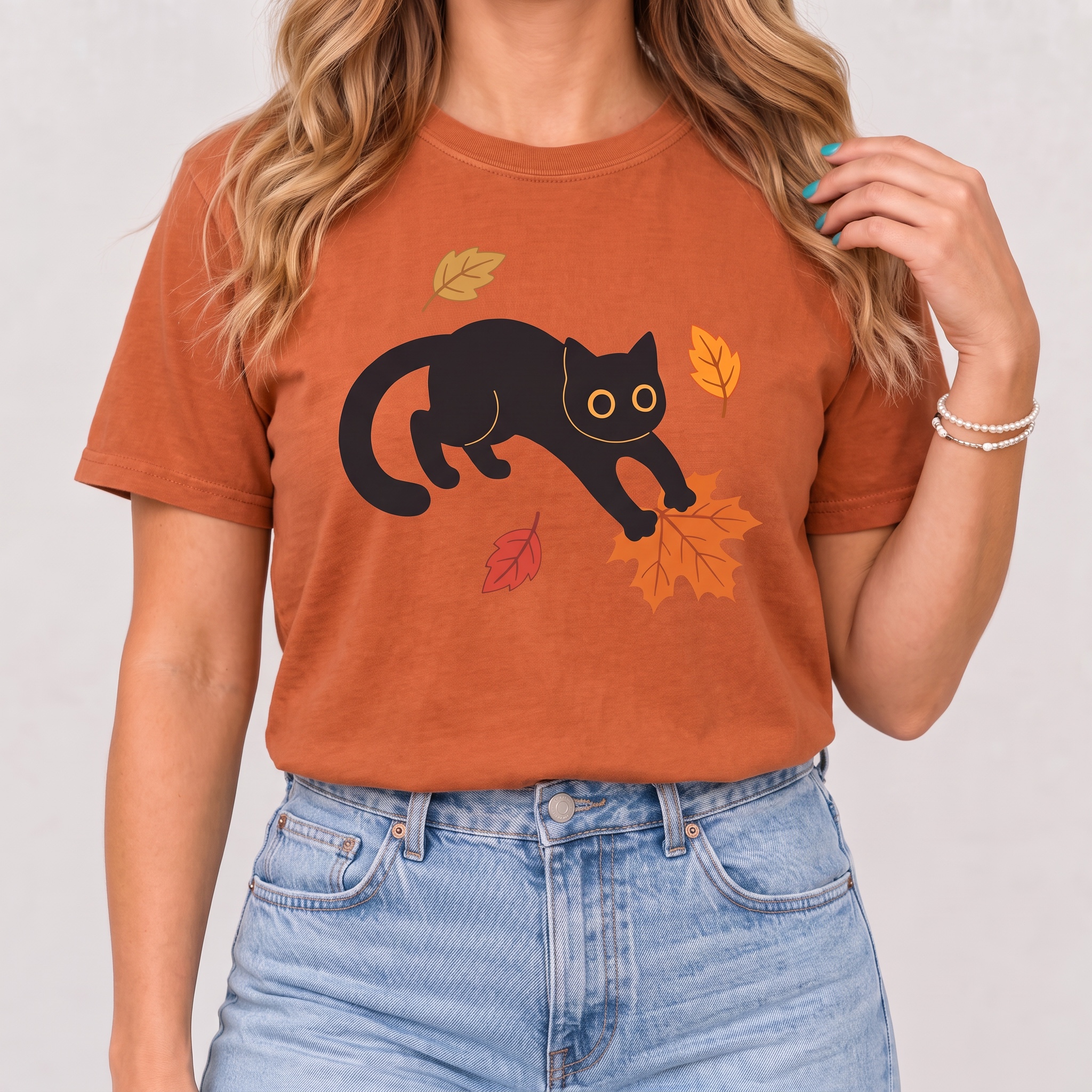 Black Cat Pouncing on Autumn Leaves Women's T-Shirt