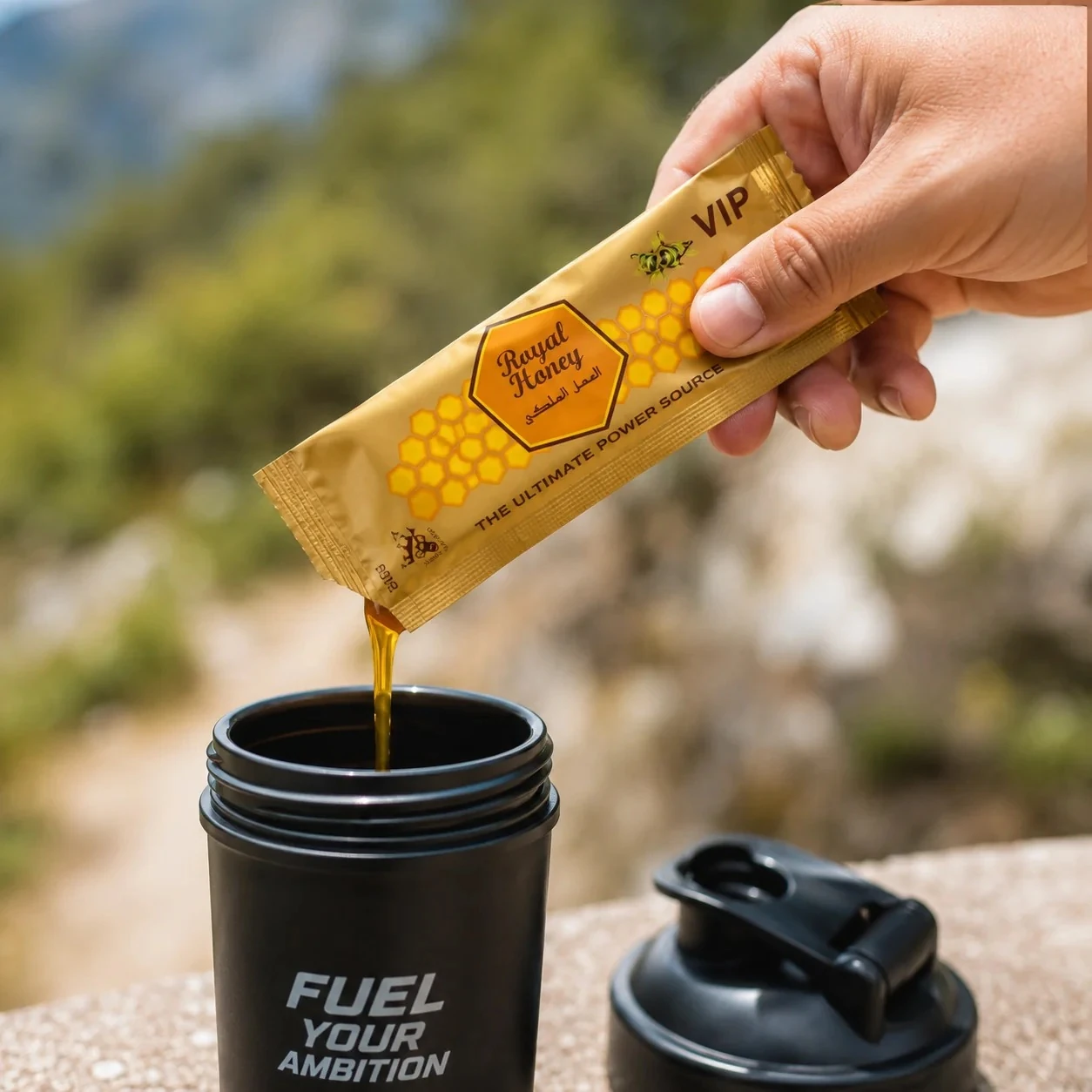 Royal Honey sachet poured into a cup outdoors
