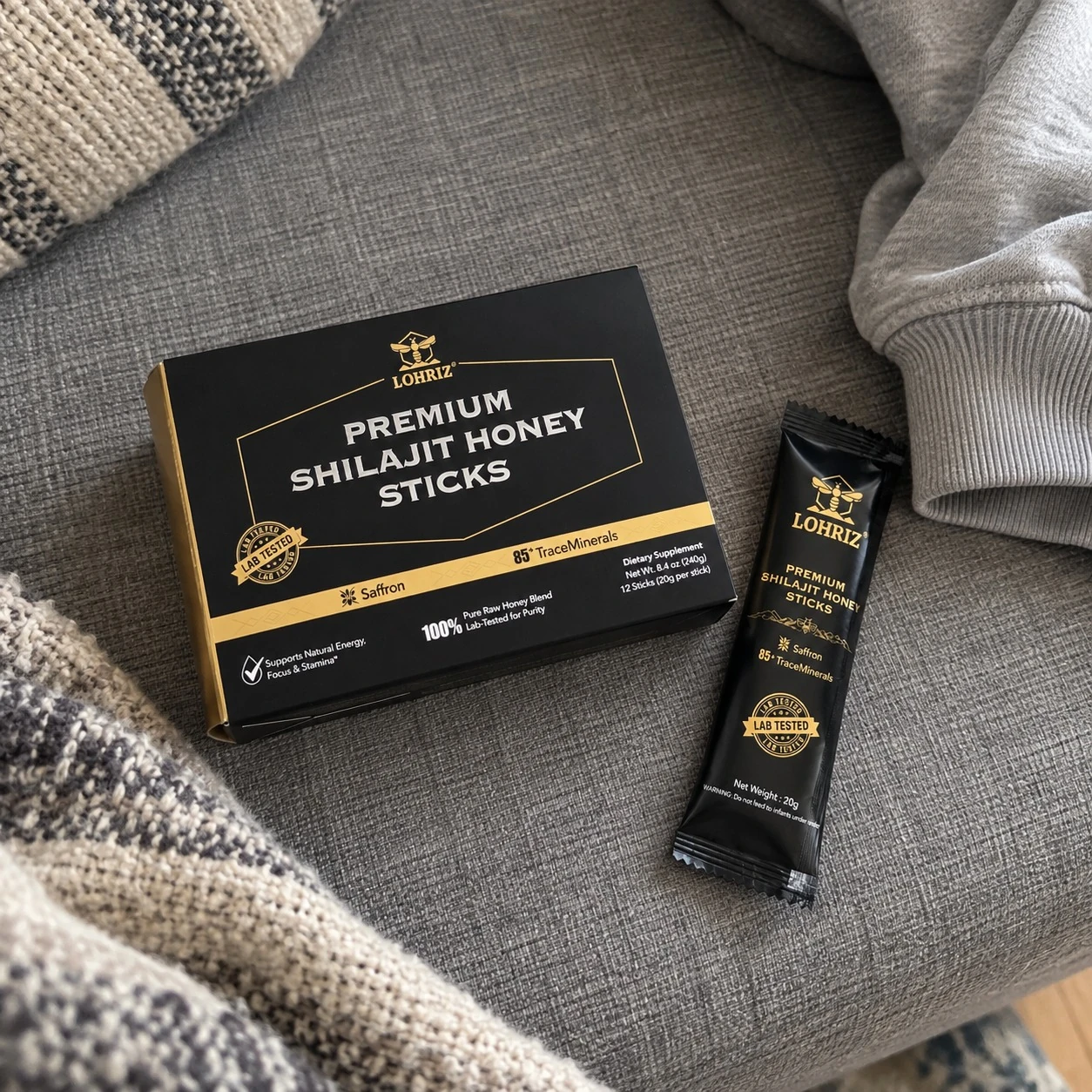 Shilajit honey box and sachet on a sofa