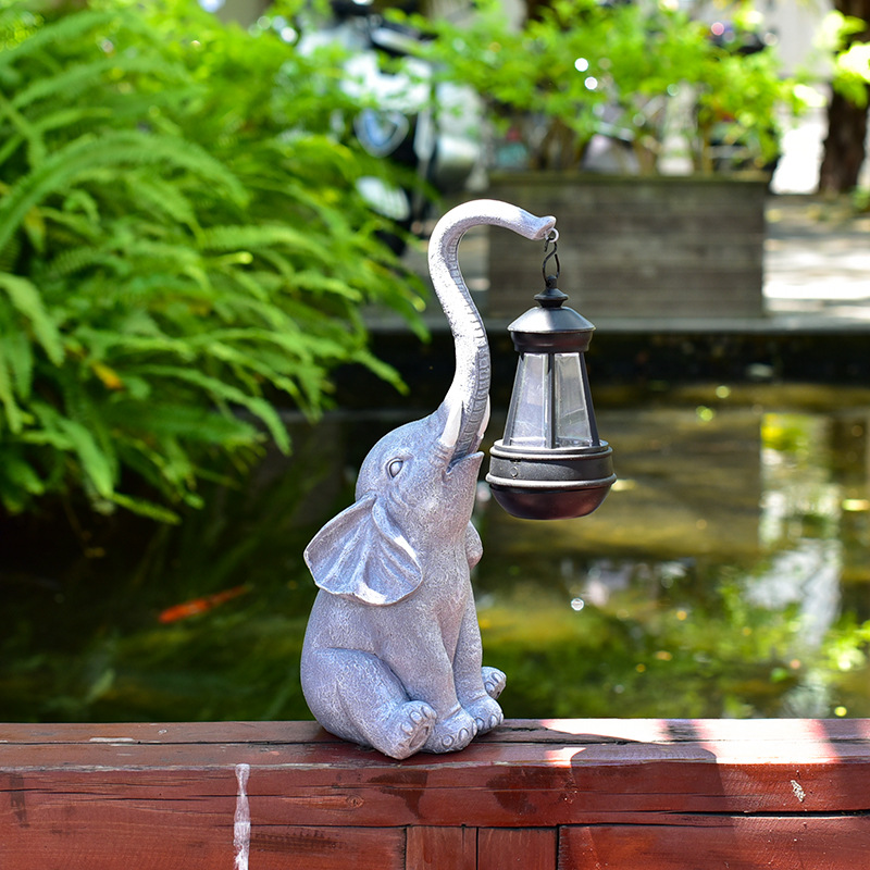 The solar powered elephant statue is suitable for garden decoration