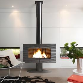 Freestanding Invicta Antaya Cast Iron Stove in a modern living room with black chimney connected with to the roof