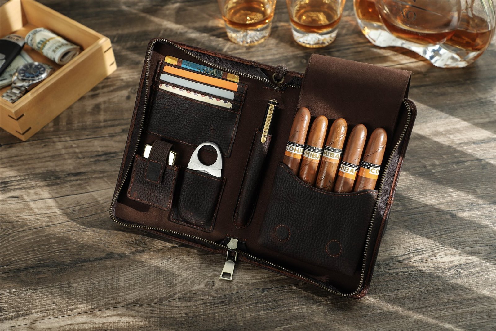 Coffee brown oil-milled leather 5-cigar case open beside whisky glasses