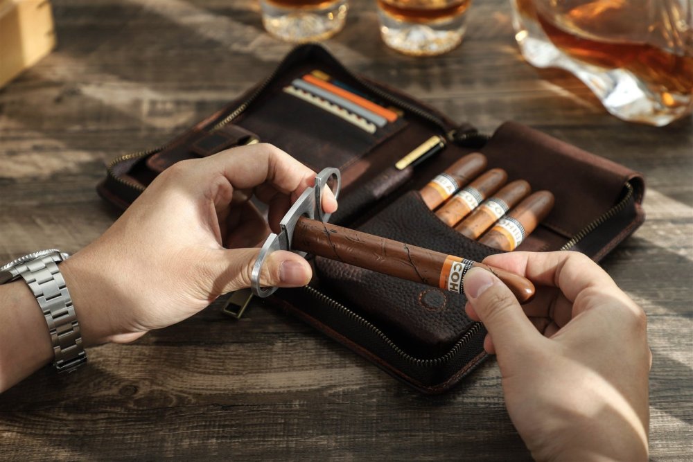 Lighting a cigar beside the open coffee brown CF5009 travel case