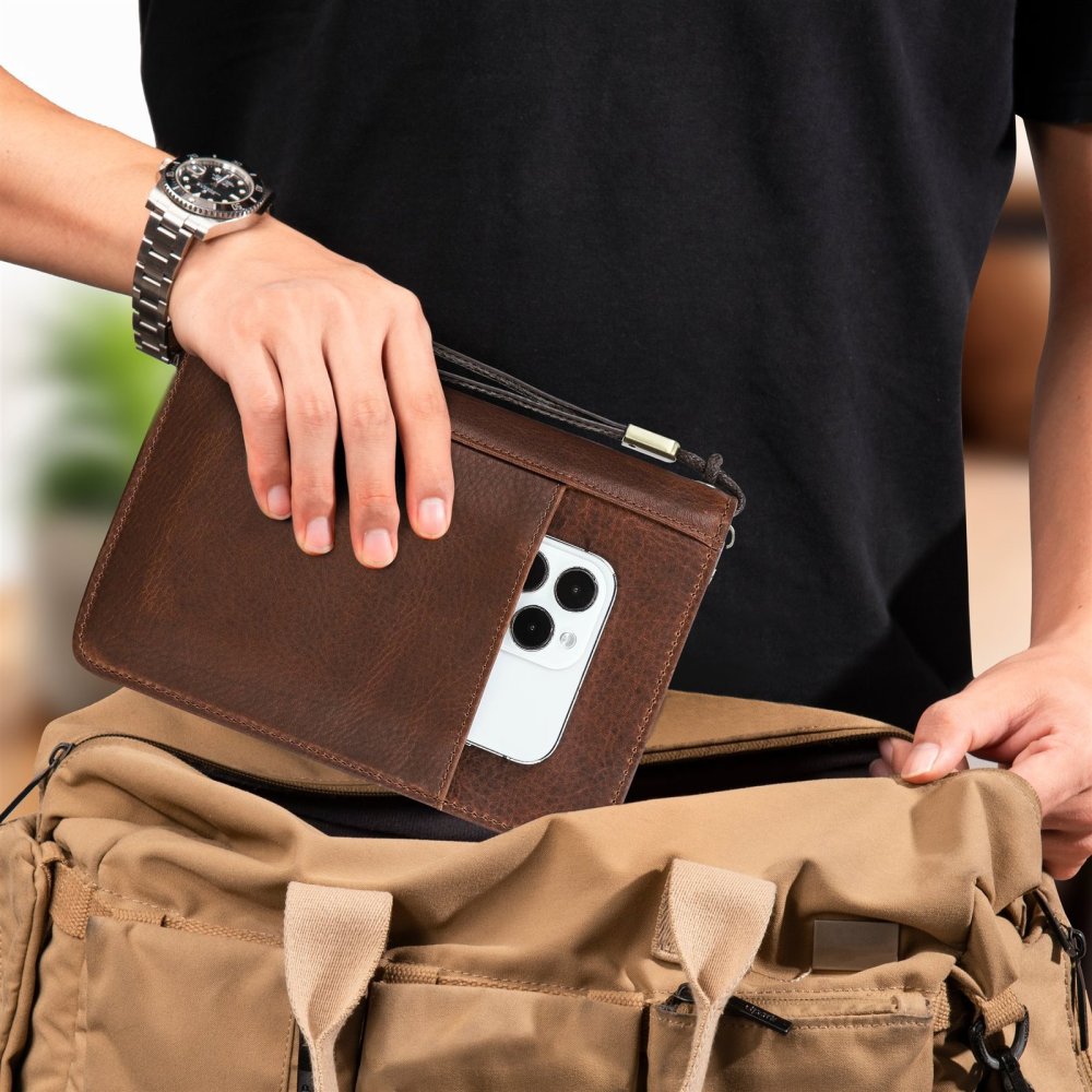Red brown CF5009 cigar case carried by hand with phone in the front pocket