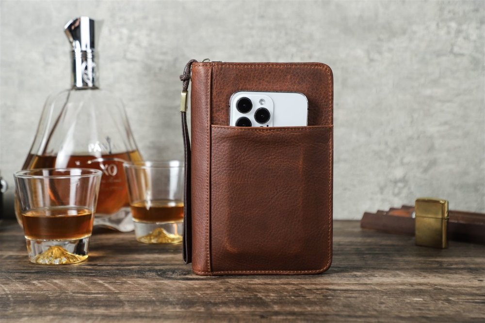 Red brown CF5009 leather cigar case standing upright next to a decanter