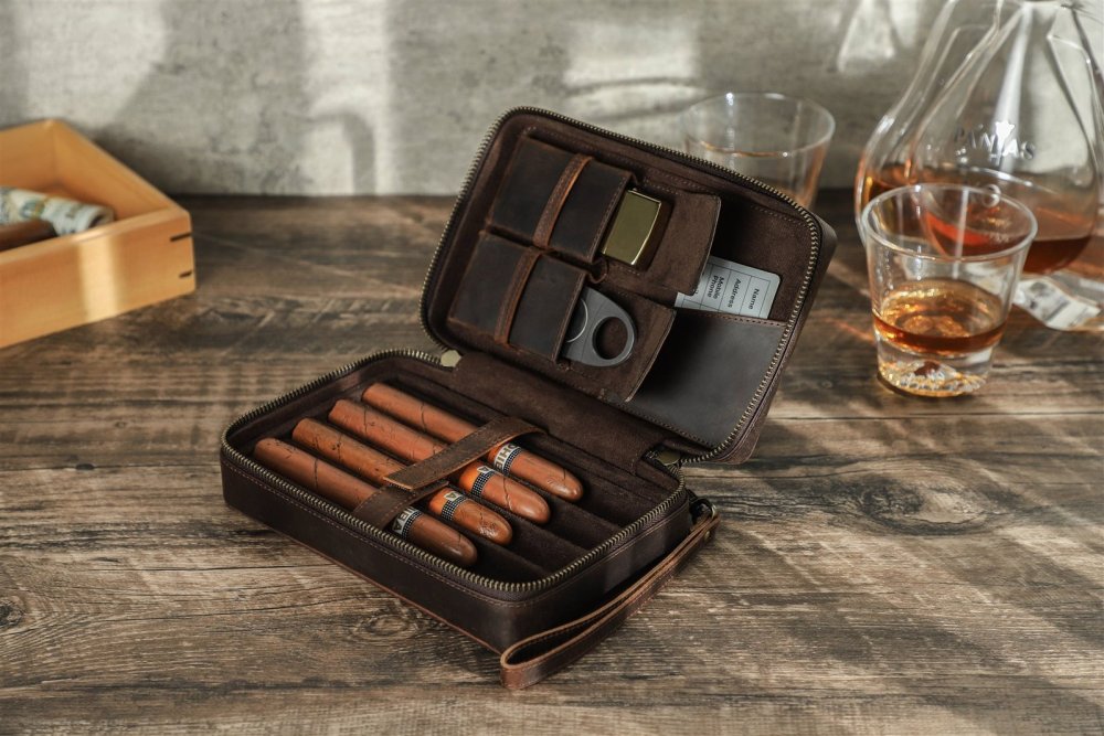 Open CF5010 leather cigar case beside whisky glasses