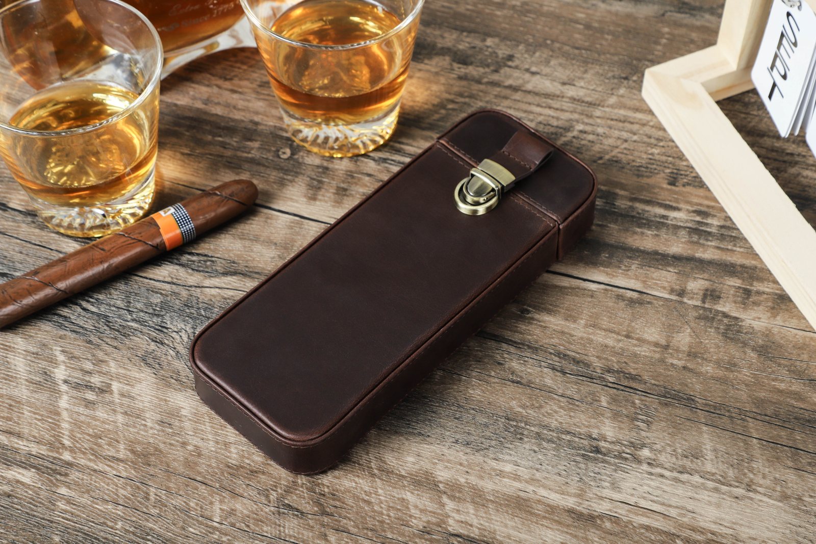 Closed CF5018 crazy horse leather cigar case on a wooden table
