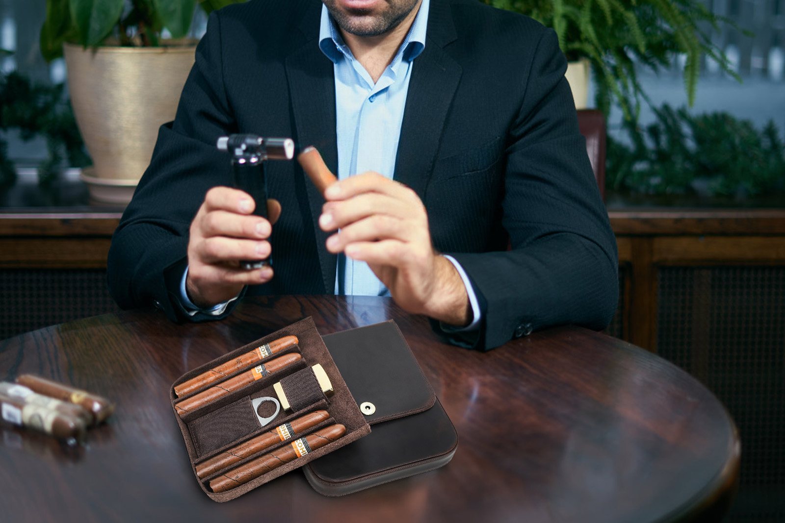 Man in a suit cutting a cigar at a table with the open CF5021 leather case