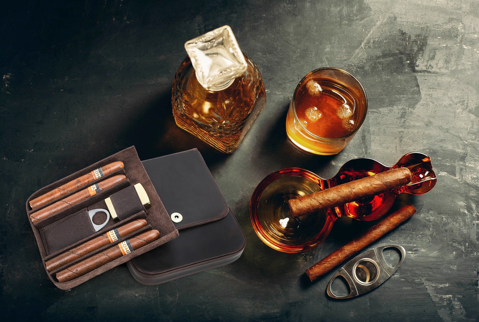 Top view of the CF5021 with four cigars beside a whisky decanter and glass