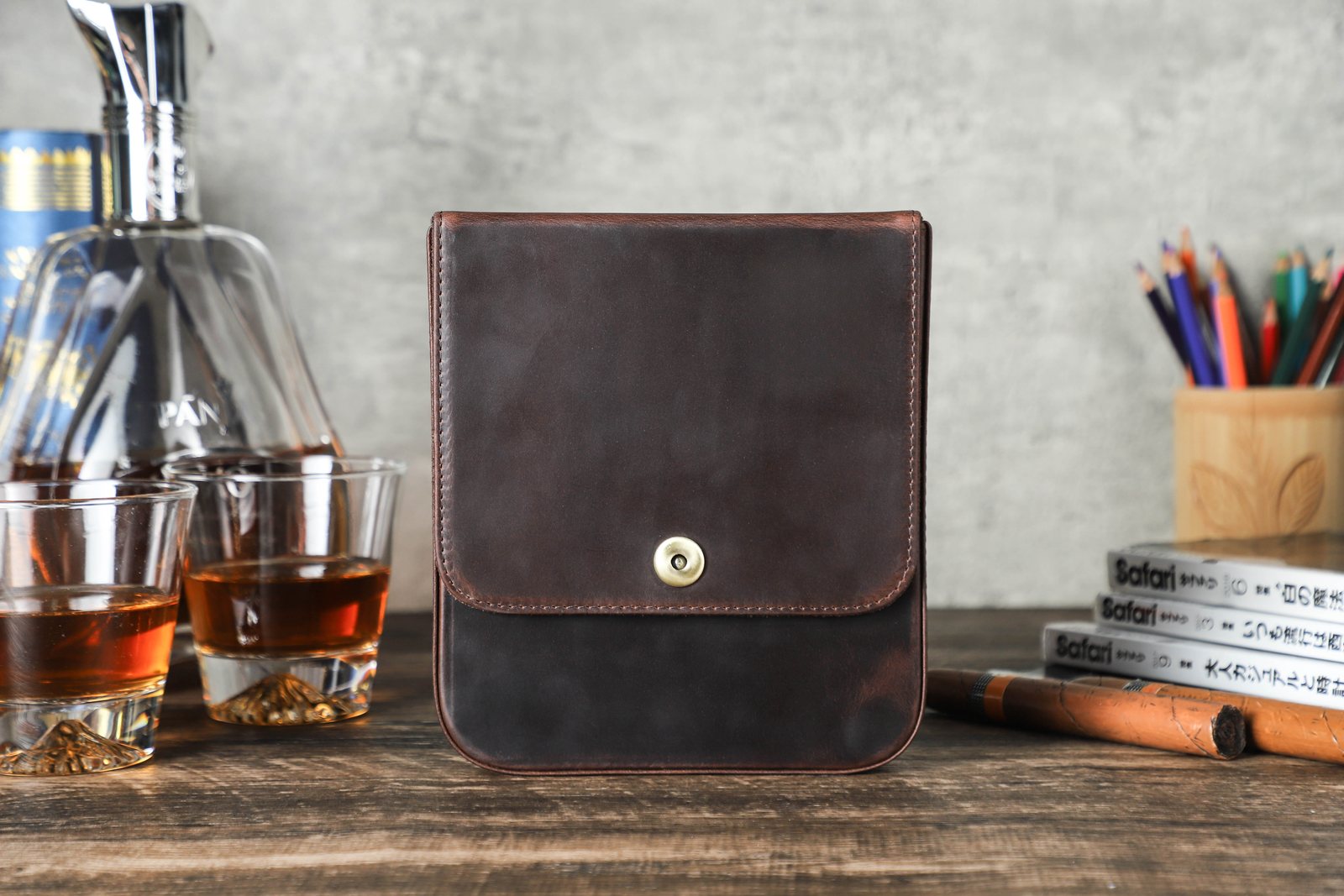 Closed CF5021 crazy horse leather flap case on a wooden table