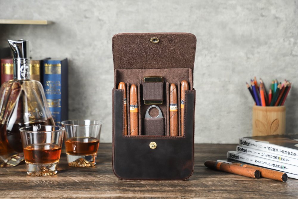 CF5021 upright with four cigars on a desk beside whisky glasses