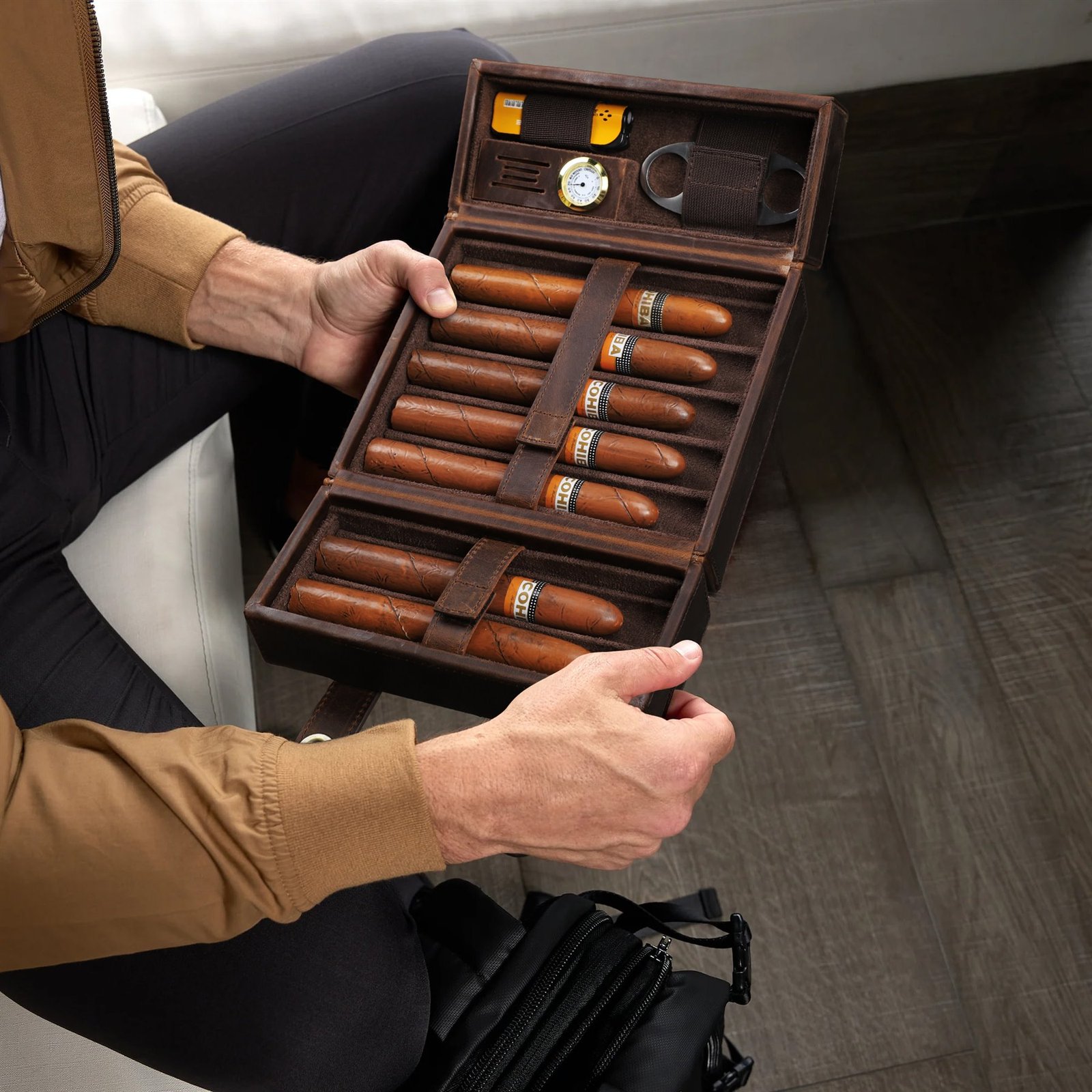 Hands holding the open CF5029 leather cigar box
