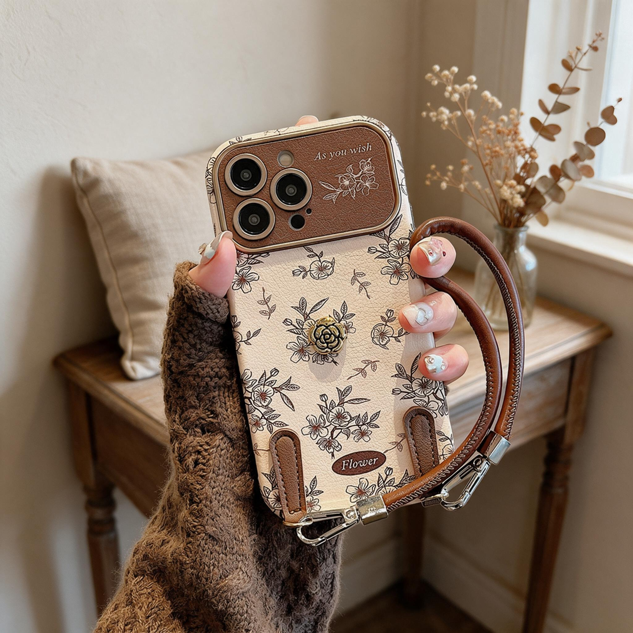 IPHONE French-style floral and camellia phone case with a wrist strap