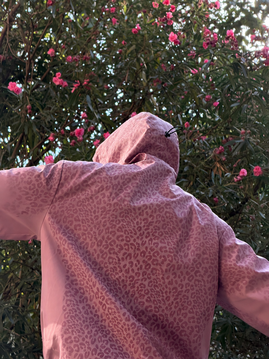 Water Reactive Cheetah Rain Jacket - Pink — source media 12