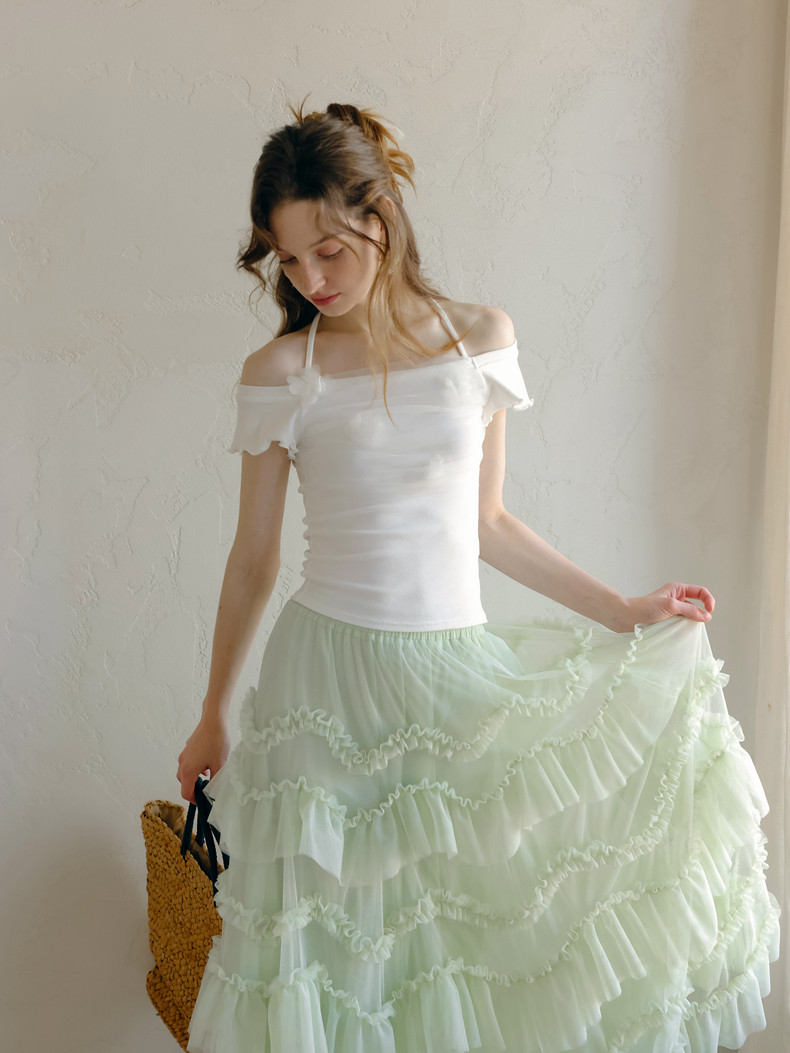 Light green tiered tulle maxi skirt on model