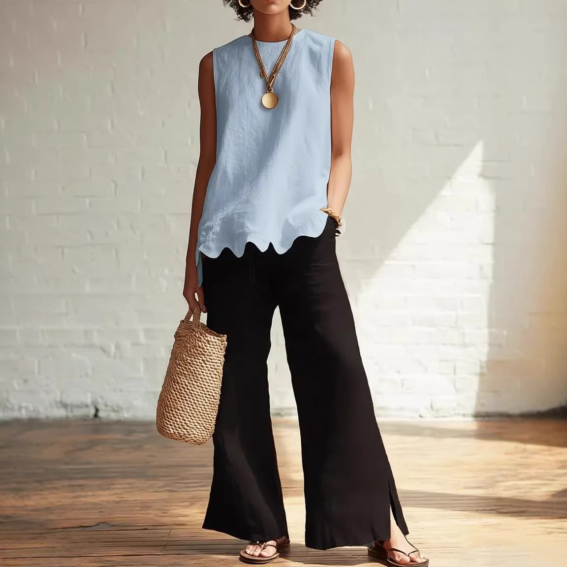Solid Crewneck Sleeveless Wavy Hem Blouse