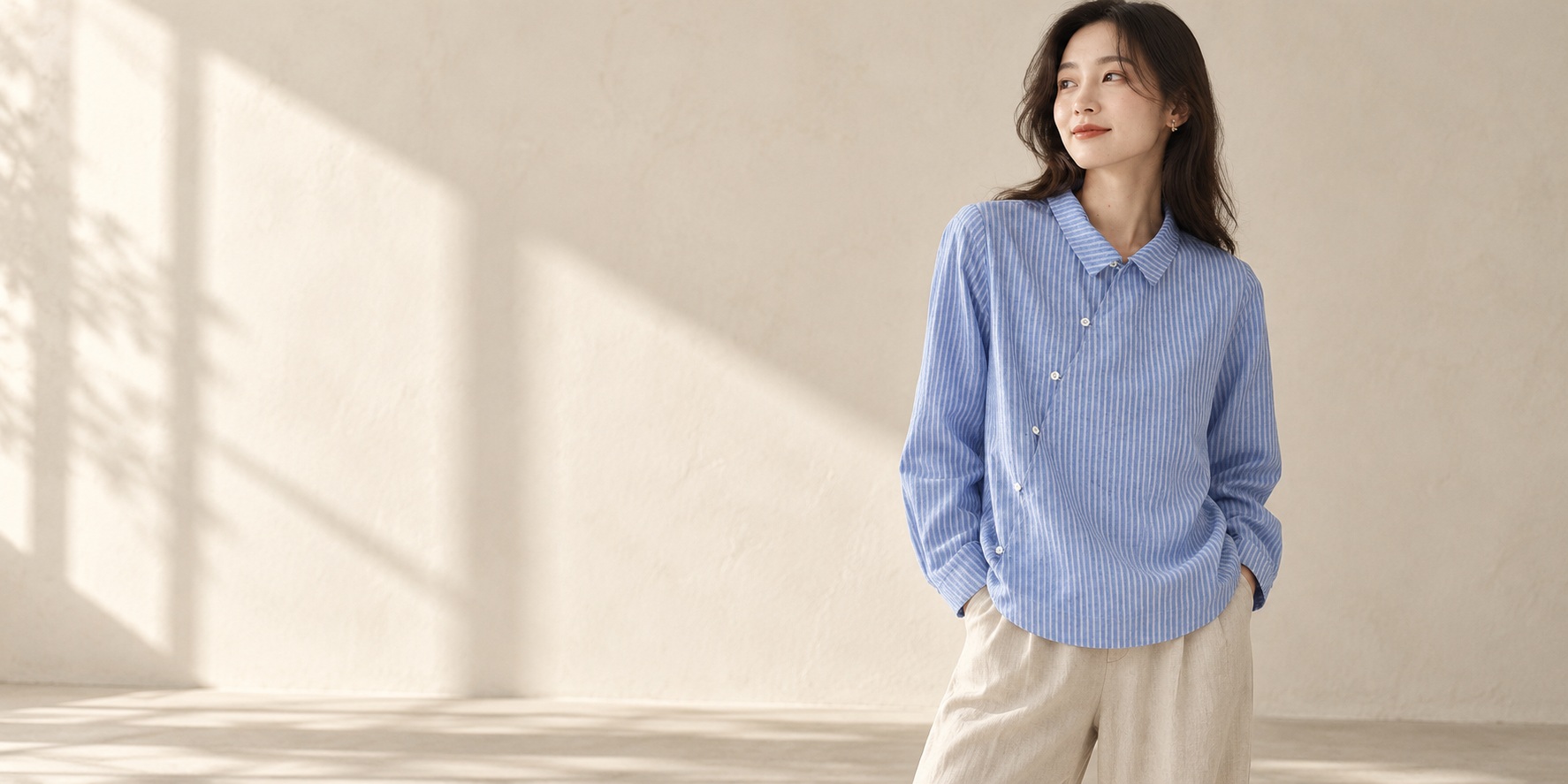 Relaxed blue striped shirt in a softly lit studio