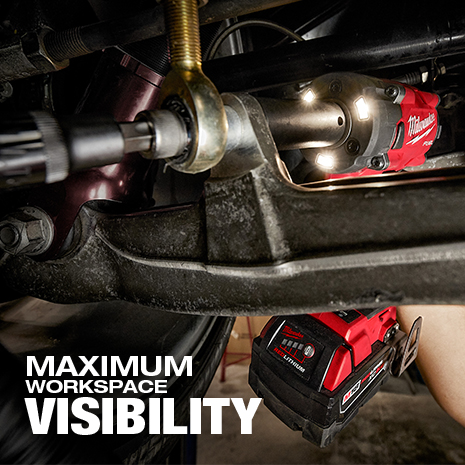 Milwaukee 2855-20 M18 FUEL GEN-3 18V Lithium-Ion Brushless Cordless 1/2 in. Compact Impact Wrench with Friction Ring (Tool-Only) Man uses the 3 integrated led lights on the Milwaukee cordless impact gun to illuminate work space.