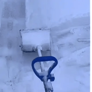 Close-up of the Beleno Cordless Snow Shoveler auger clearing snow