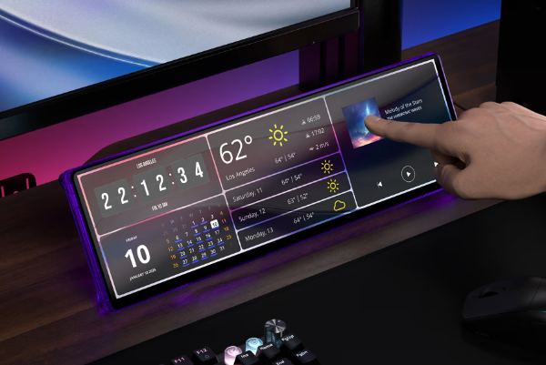 Hand touching the touchscreen showing weather, calendar and music
