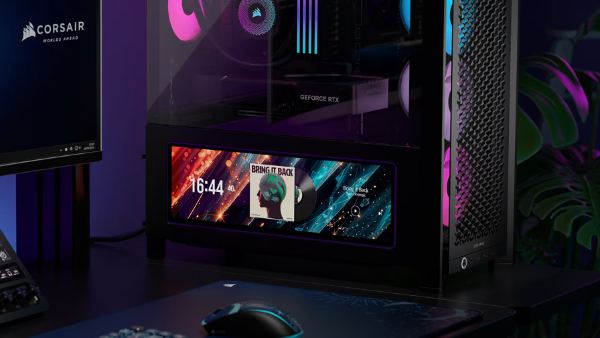 Display inside a PC case showing a music player widget
