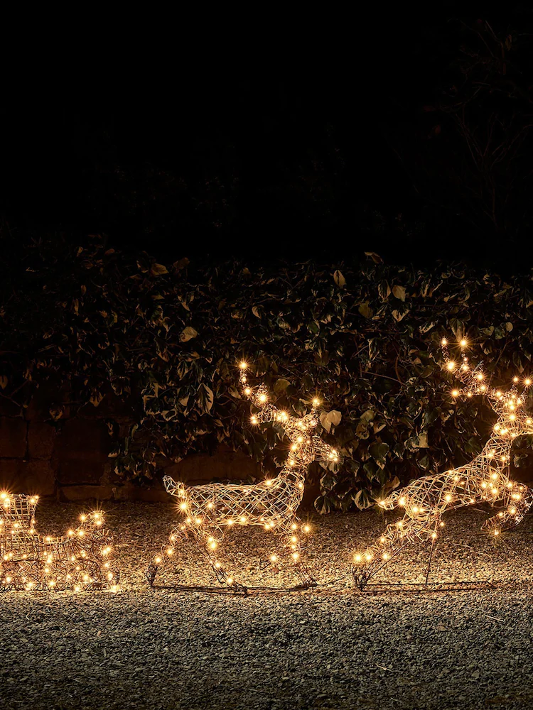 Renne et traîneau lumineux en rotin – 86 cm