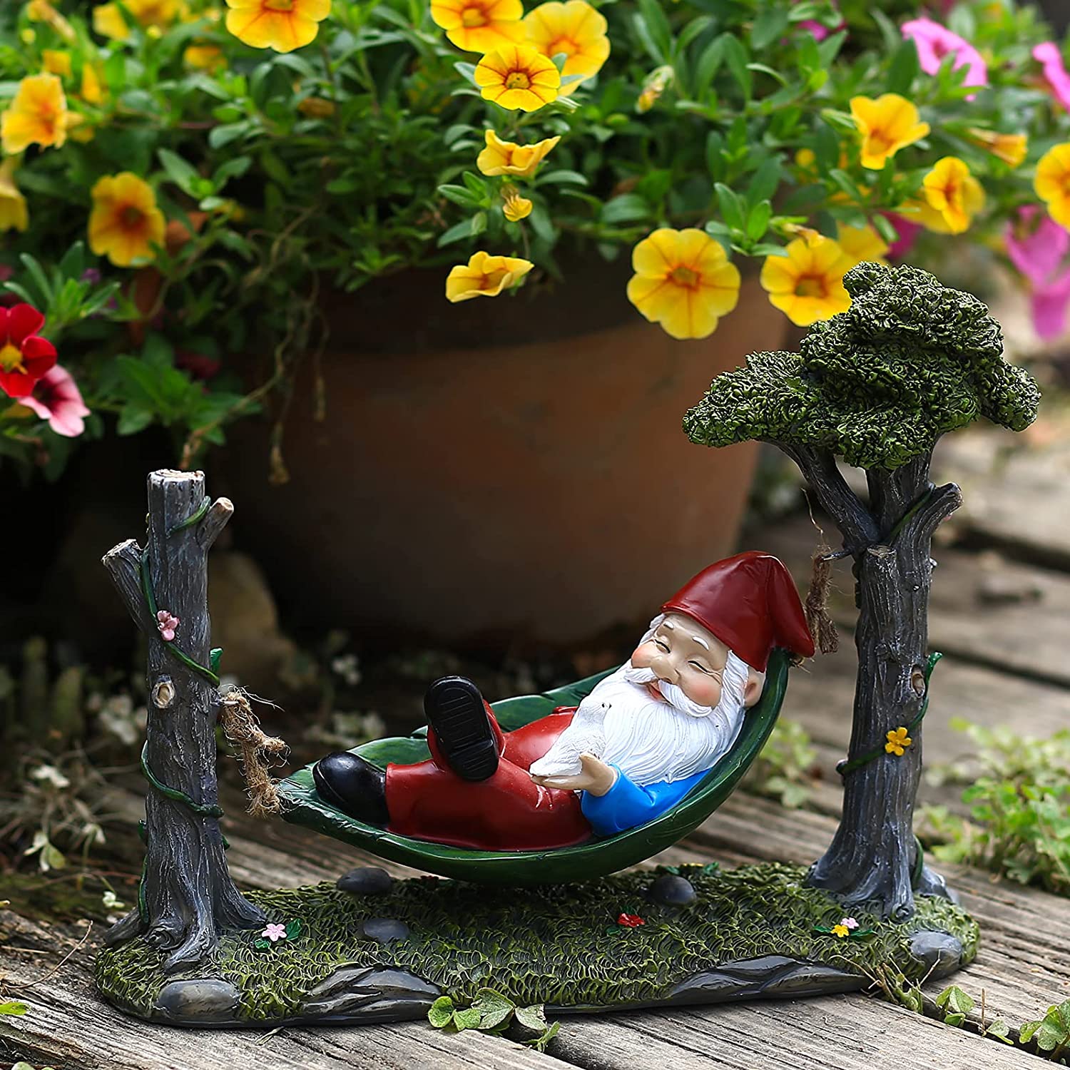 Garden Gnome Statue Lying In Hammock Hanging From Tree-xinru