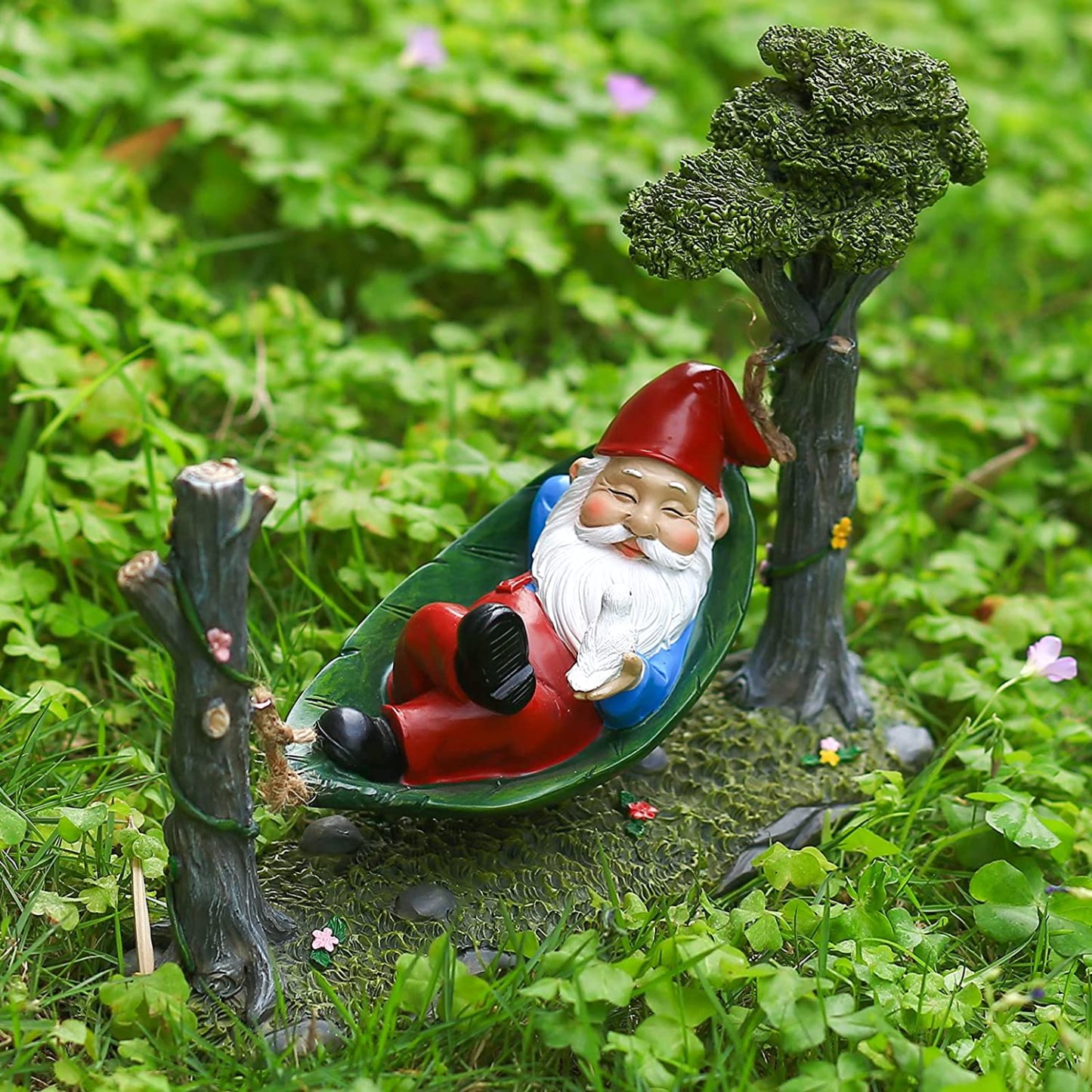 Garden Gnome Statue Lying In Hammock Hanging From Tree-xinru