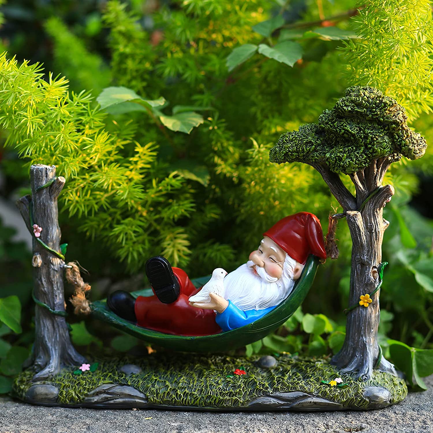 Garden Gnome Statue Lying In Hammock Hanging From Tree-xinru