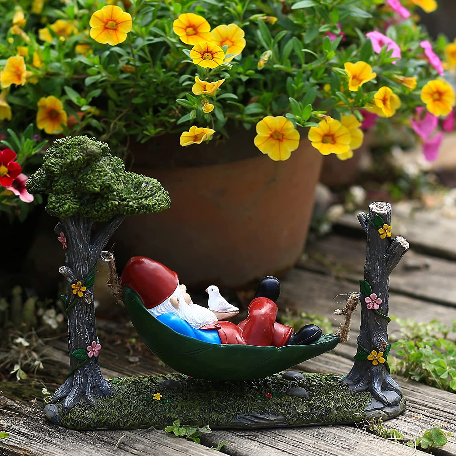 Garden Gnome Statue Lying In Hammock Hanging From Tree-xinru