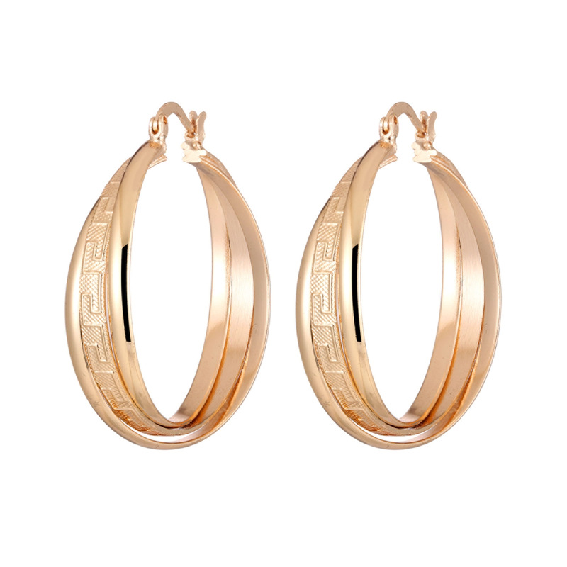 Textured laminated 18K gold round female earrings