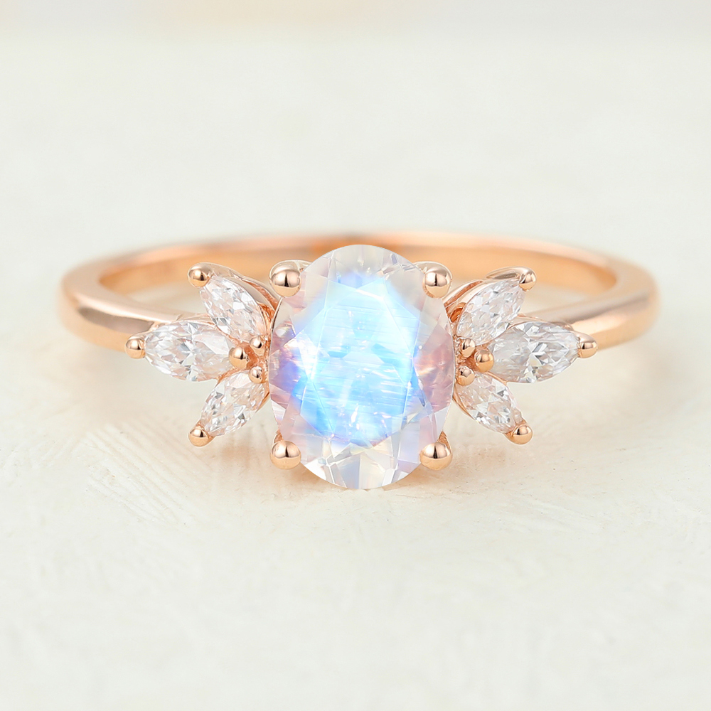 Oval Cut Moonstone and Diamond Side Stone Engagement Ring