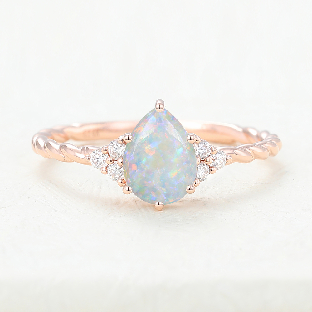 Juyoyo pear shaped opal rose gold 3/4 eternity Twisted engagement ring