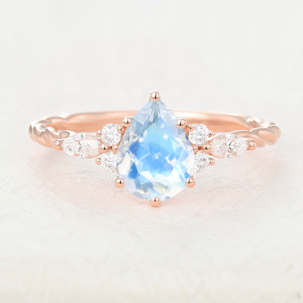 Juyoyo Twisted Pear Shaped Moonstone and Diamond Side Stone Ring in Rose Gold