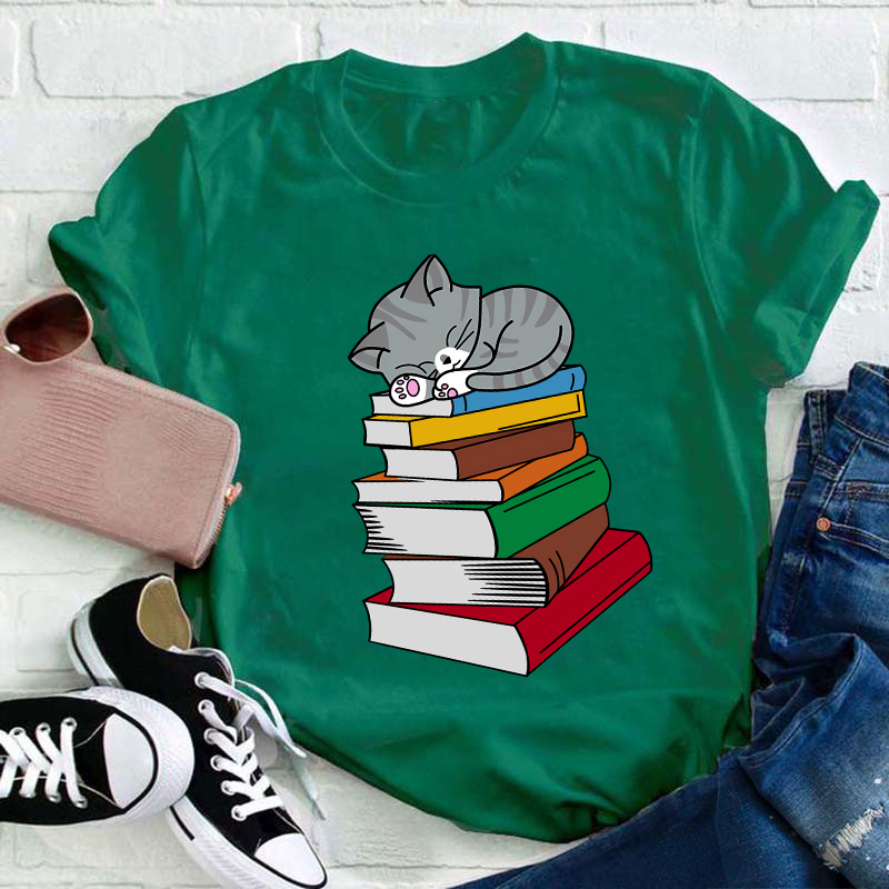 Cat Sleeps On A Book Teacher T-Shirt