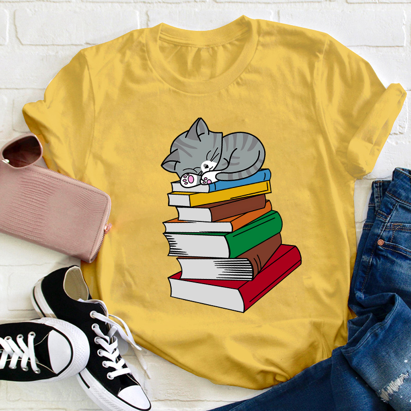 Cat Sleeps On A Book Teacher T-Shirt