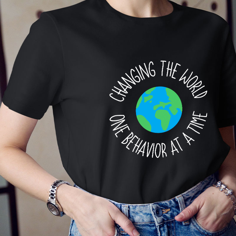 Changing The World One Behavior At A Time Teacher T-Shirt
