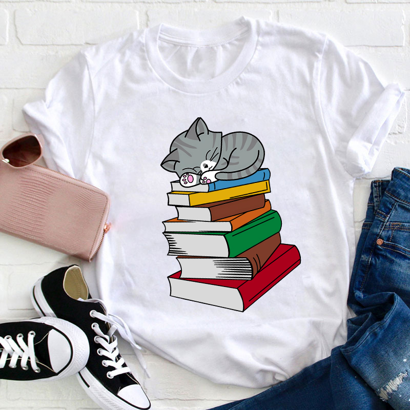 Cat Sleeps On A Book Teacher T-Shirt