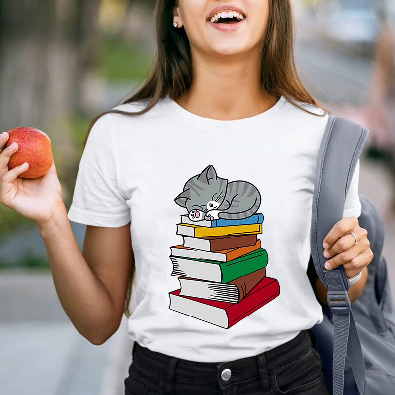 Cat Sleeps On A Book Teacher T-Shirt