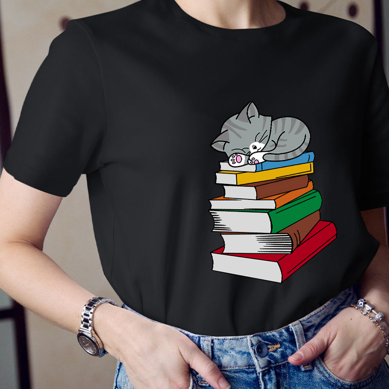 Cat Sleeps On A Book Teacher T-Shirt