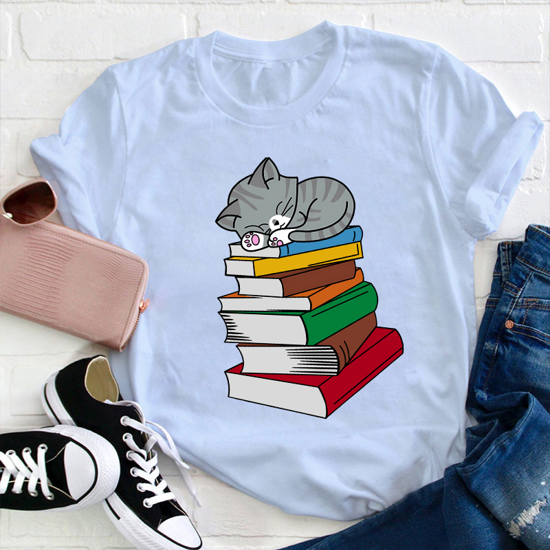 Cat Sleeps On A Book Teacher T-Shirt