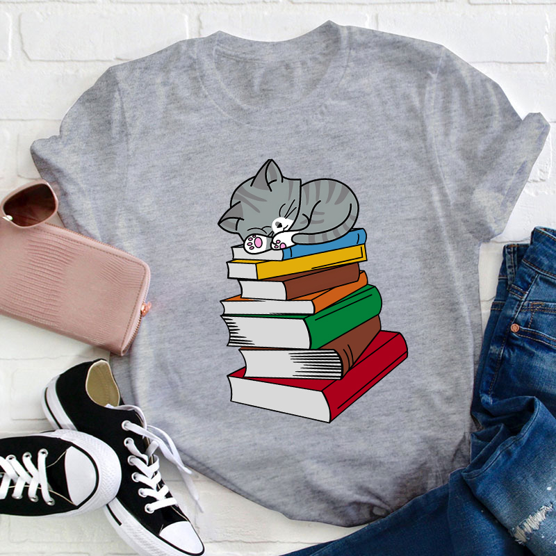 Cat Sleeps On A Book Teacher T-Shirt