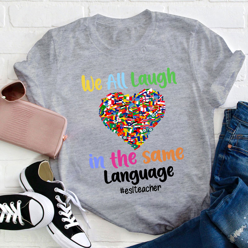 We All Laugh In The Same Language Teacher T-Shirt