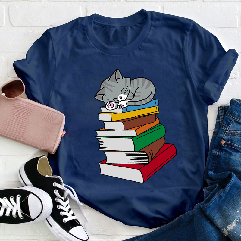 Cat Sleeps On A Book Teacher T-Shirt