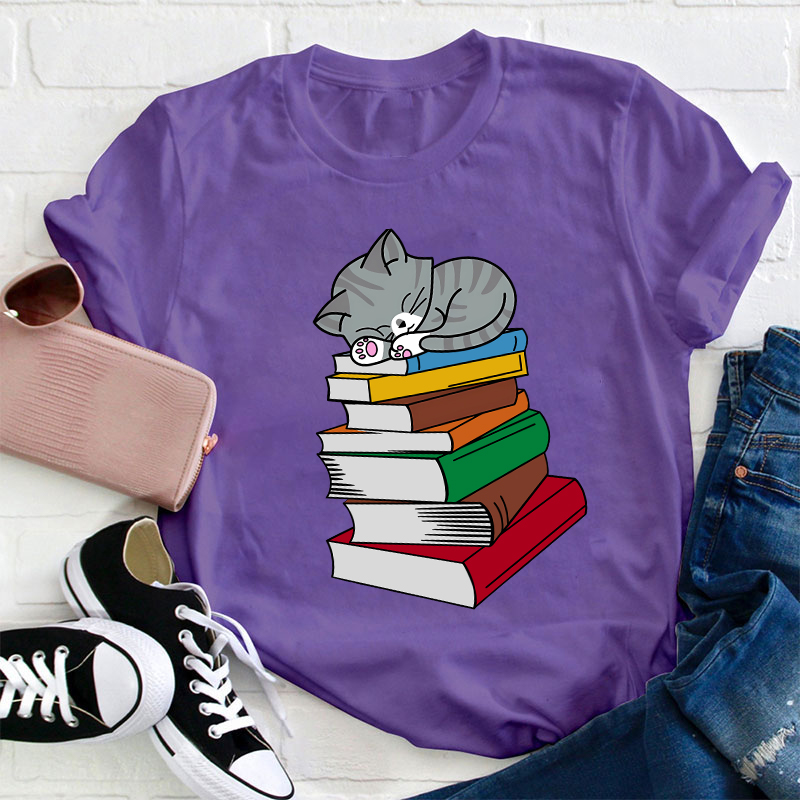Cat Sleeps On A Book Teacher T-Shirt