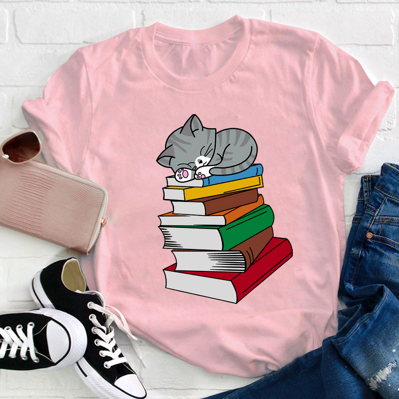 Cat Sleeps On A Book Teacher T-Shirt