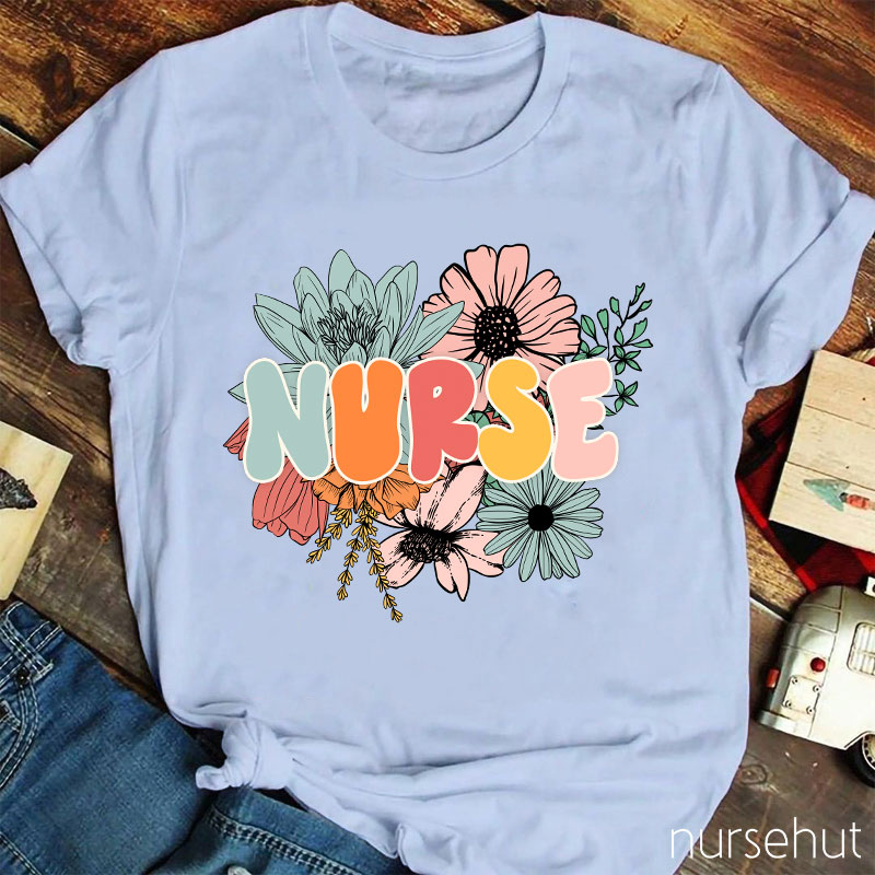 A Nurse Surrounded By Flowers Nurse T-Shirt